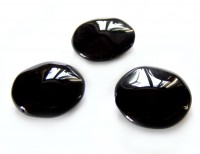 Unebenmäßige Scheibe, schwarz glänzend Unebenmäßige Scheibe, schwarz glänzend